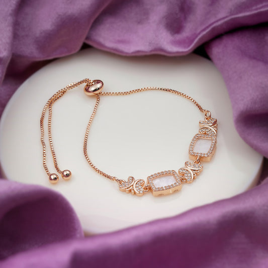 Rose gold CZ slider bracelet with butterfly charms and square stone centerpiece