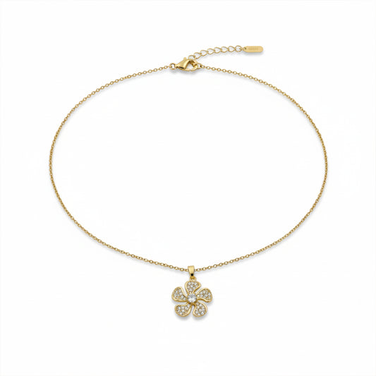 Gold link chain necklace with four-petal crystal flower pendant and clasp