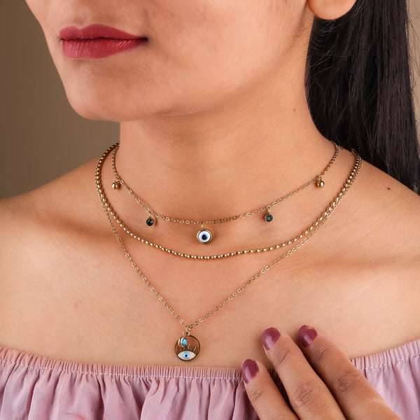 Gold triple-layer evil-eye charm necklace with round eye pendant