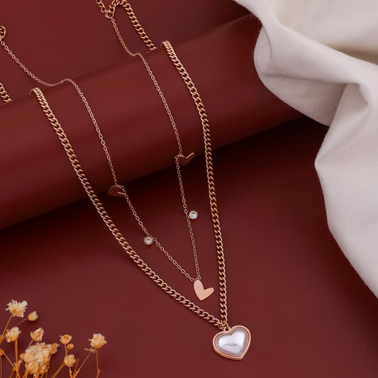 Rose gold double-layer heart charm necklace with multiple small hearts and one heart pendant