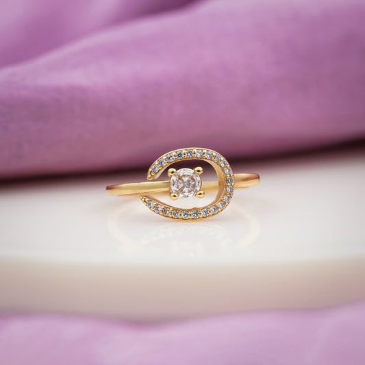 Rose gold-tone crescent solitaire bypass ring with halo of small crystals