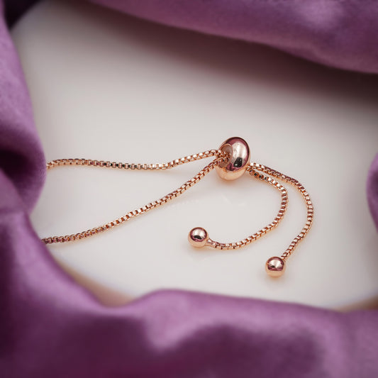 Rose gold slider bracelet with adjustable chain and bead ends