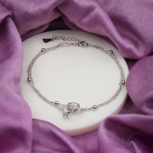 Silver-tone chain anklet with heart locket charm, small sparkle crystal, and ring links