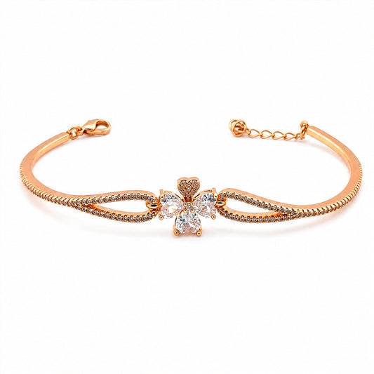 Rose gold CZ four-petal flower bangle bracelet, curved cuff with linked chain detail