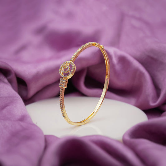 Gold spiral CZ kada bangle with round and square stone accents