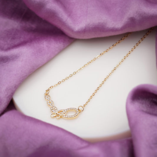 Gold-tone CZ pendant necklace with marquise and oval stone butterfly centerpiece