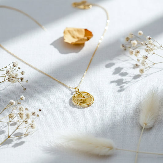 Gold compass sunburst pendant necklace with double-disc charm