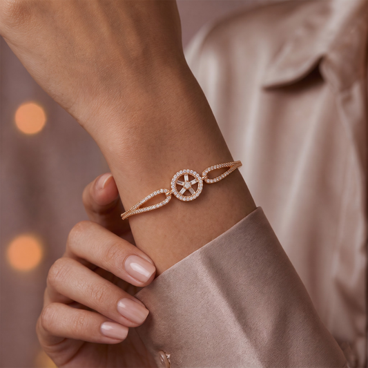 Rose gold CZ compass wheel medallion bangle bracelet on wrist