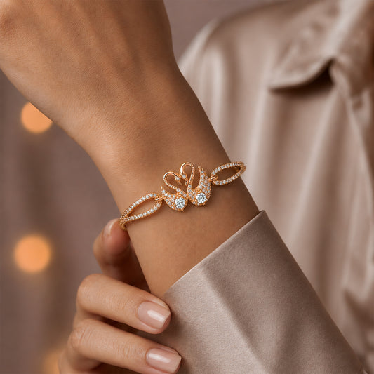 Rose gold swan bangle bracelet with oval CZ stones and curved band for wrist wear