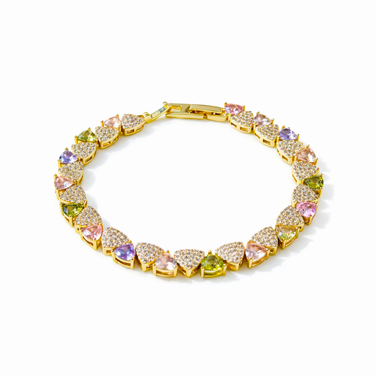 Gold-tone tennis bracelet with multicolor oval stones in gold prong setting