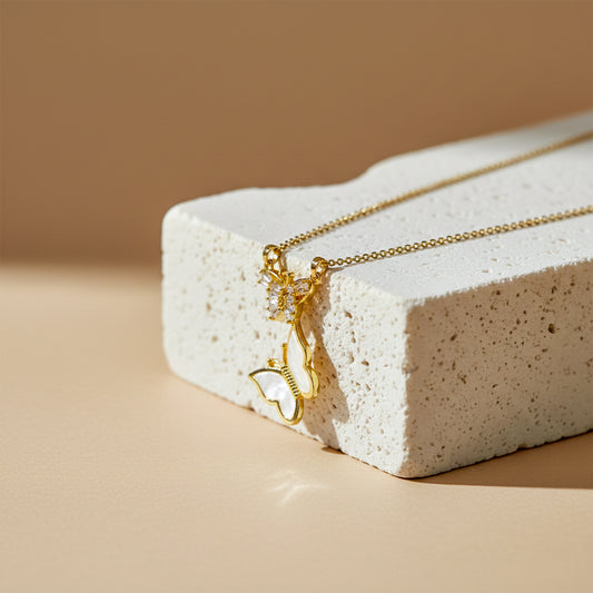 Gold butterfly pendant necklace with crystal details on thin chain