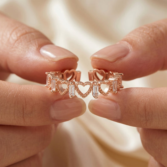 Rose gold open-heart eternity ring on fingers, baguette CZ stones, adjustable fit