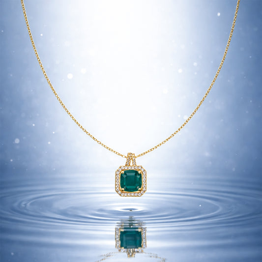 Gold-tone chain necklace with emerald-green square crystal halo pendant