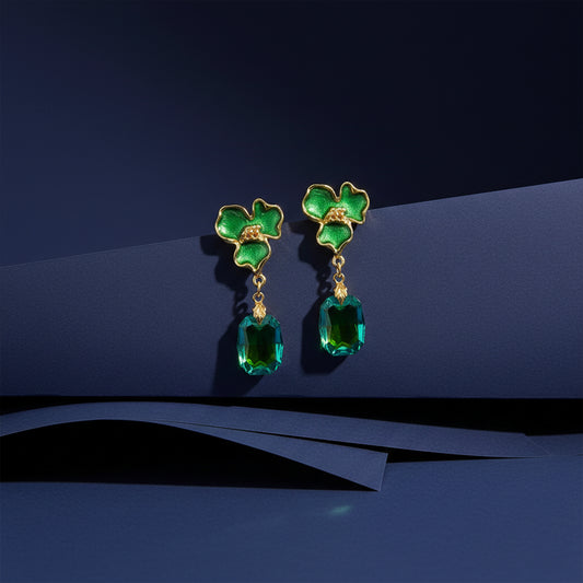 Green flower drop earrings with gold-tone links and faceted green crystal teardrop dangles