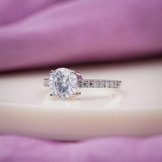 Silver ring with round crystal solitaire and pavé band