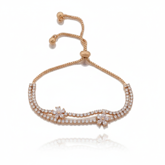 Adjustable slider bracelet, gold-tone with clear rhinestone row and floral center