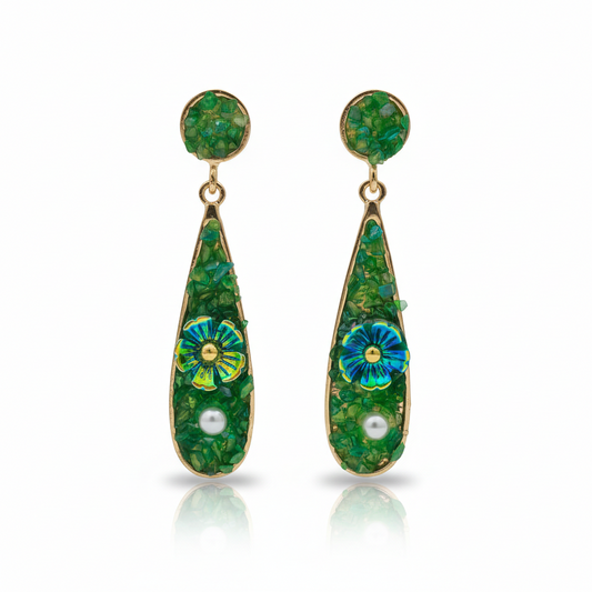Green teardrop earrings with gold hooks, blue flower accents, and white pearl drops