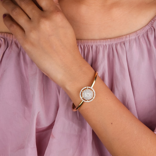 Gold dome pavé crystal cuff bracelet on a woman's wrist