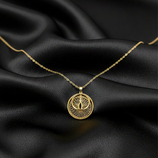 Gold double-disc compass pendant on a chain